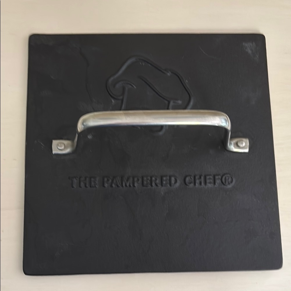 The Pampered Chef Black Grill Press with Silver Handle